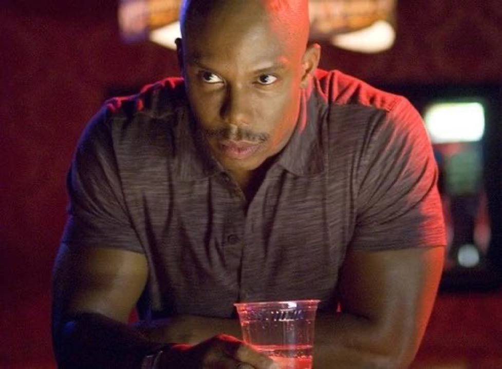 Doakes with a drink in a bar